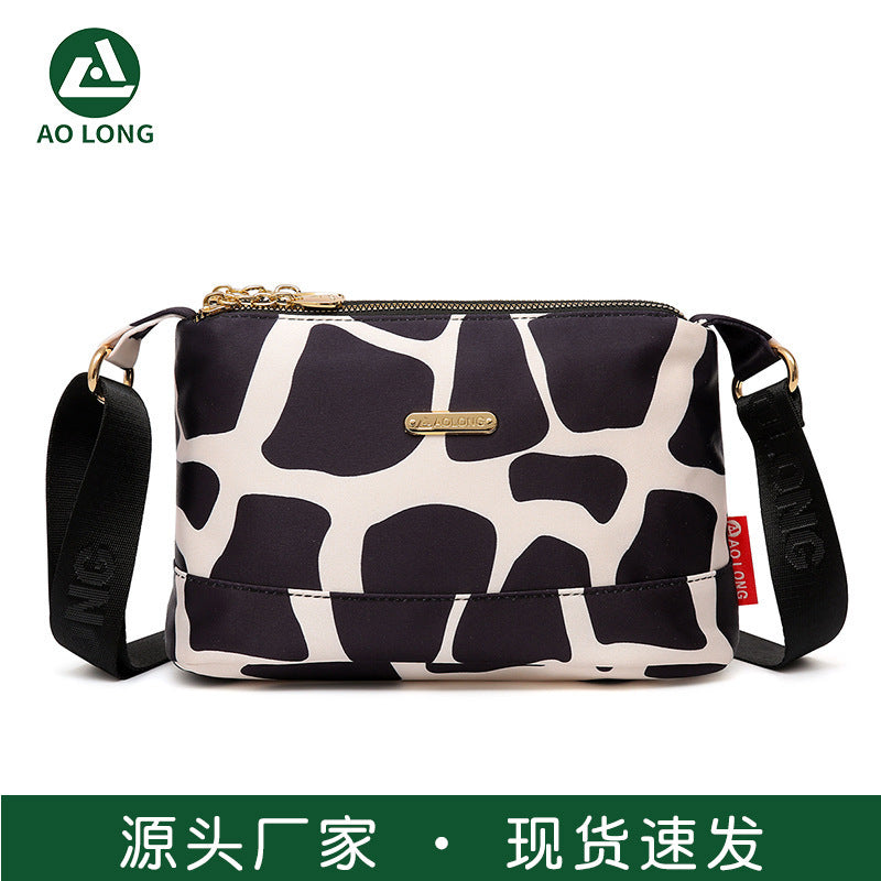 Naisten monitaskuinen painettu ristikkolaukku